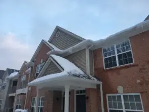 snow covered roof in winter storm