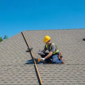 Professional roofing contractor inspecting a residential roof in Bloomfield Hills